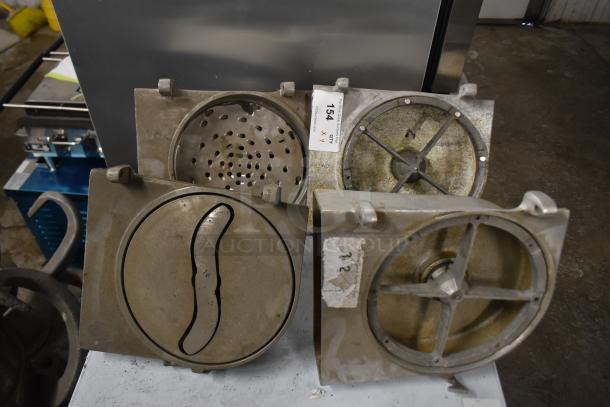 4 Pelican heads with 2 blades for grating and slicing, without front pieces. Visible auction tag and markings. Used condition.