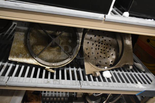 Four pelican heads with two blades for grating and slicing; lacks front pieces. Auction includes four sets.