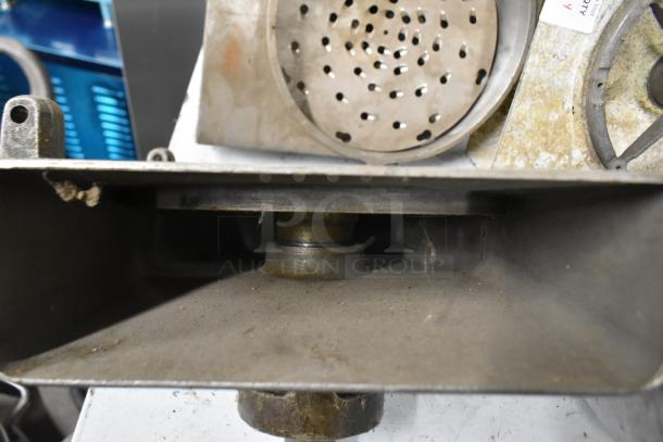 4 Pelican heads with 2 blades for grating and slicing. No front pieces included. Used condition, suitable for industrial use.