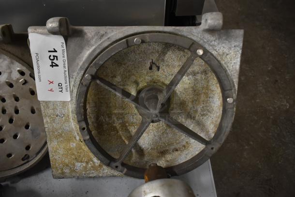 4 Pelican heads with 2 blades for grating and slicing; no front pieces; item tagged with auction lot number.