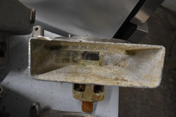 Four pelican heads with two blades for grating and slicing, missing front pieces, in worn condition.