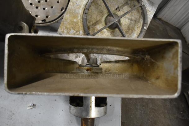 4 Pelican heads with 2 blades for grating and slicing, no front pieces. Metal construction, shows signs of wear.