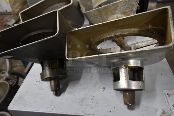 4 Pelican heads with 2 blades for grating and slicing, no front pieces, metal construction, used condition.