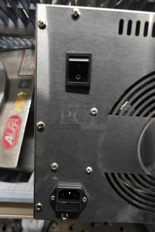 Brand new Avantco 177LT06A 6-tray stainless steel food dehydrator, scratch and dent condition, with glass door, 120V.