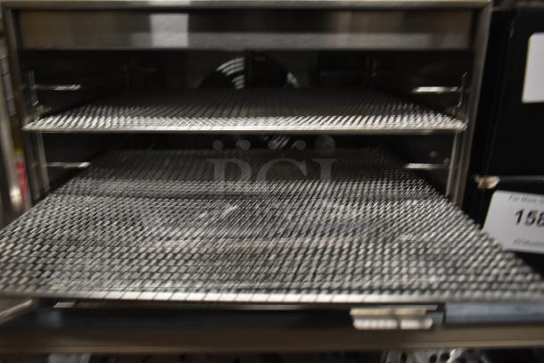 Avantco 177LT06A stainless steel food dehydrator with 6 trays, glass door; only works on highest heat setting; 120V, 1 phase.