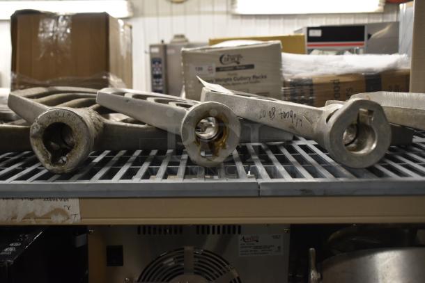 9 Hobart mixer paddle attachments, various conditions, visible markings indicate wear and previous use, ideal for mixers.