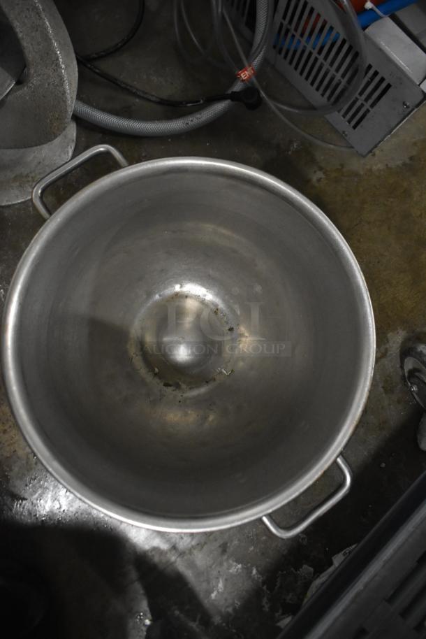 Stainless steel mixing bowl with handles, part of 8-item set including 5 dough hooks for Hobart mixer, in used condition.