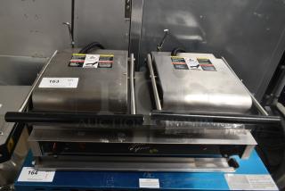 Brand new Star GX20IG 20" double sandwich grill with grooved cast iron plates, dual 10" x 10" cooking surface. Scratch and dent condition. 208/240 volts, 1 phase.