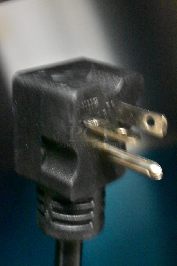Close-up of a black power plug for the Avantco 177CHSME32M Commercial Cheese Melter.