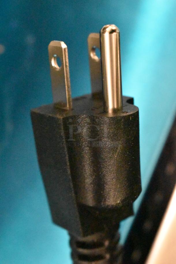 Close-up of a power plug for the Avantco 177C15 Pourover Airpot Coffee Brewer, 120 volts, 1 phase, black finish.
