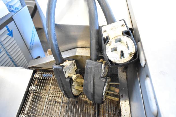 Turbochef HhC2020 commercial electric conveyor oven connections, showing 208/240V, 3-phase plugs. Visible wear.