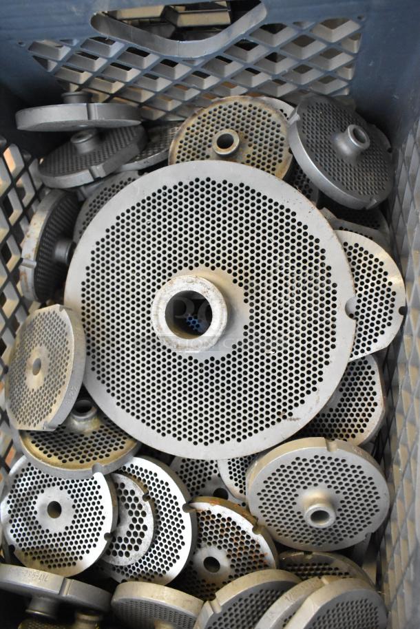 110 various metal plates for meat grinders in used but good condition, featuring different hole sizes, suitable for customization.