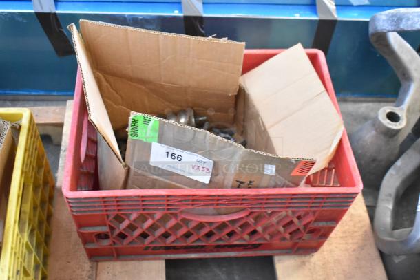 Box of 53 various knives for meat grinders in red crate, mixed condition, auction lot labeled as "166 QTY VX53".