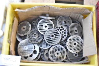 Box of 63 metal grinder plates, used for meat grinders, in varied condition. Circular with perforated designs.