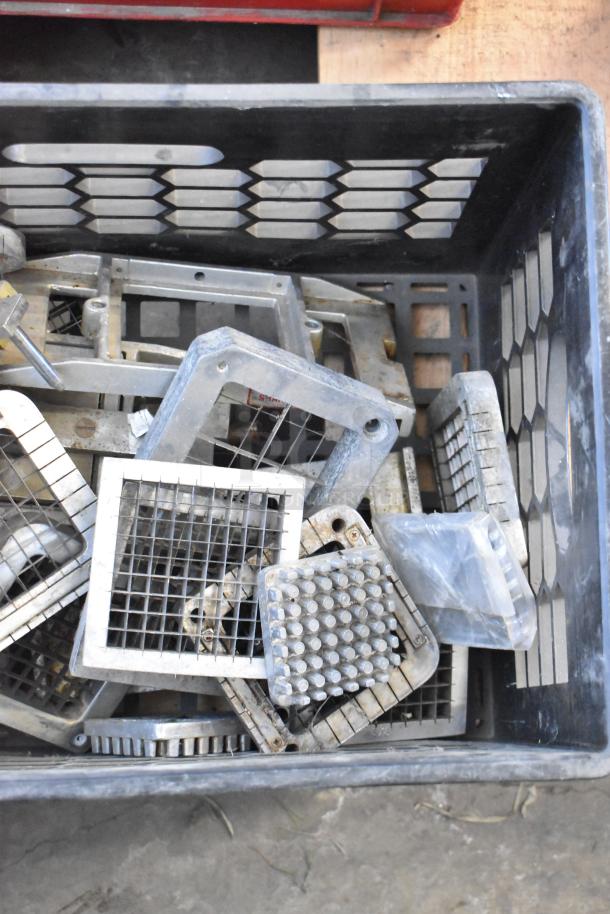 26 various vegetable slicer blades in a crate, used condition. Ideal for food processors and commercial kitchens.