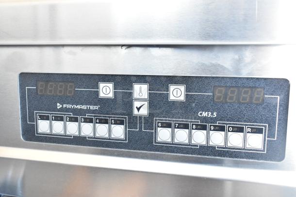 Close-up of Frymaster FPPH255CSE fryer control panel with digital display. Brand name and model visible.
