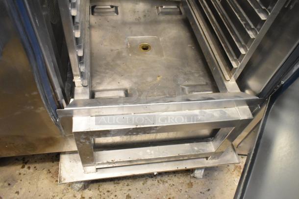Alto Shaam stainless steel combi convection oven interior with roll-in pan rack; door not closing with rack inside.
