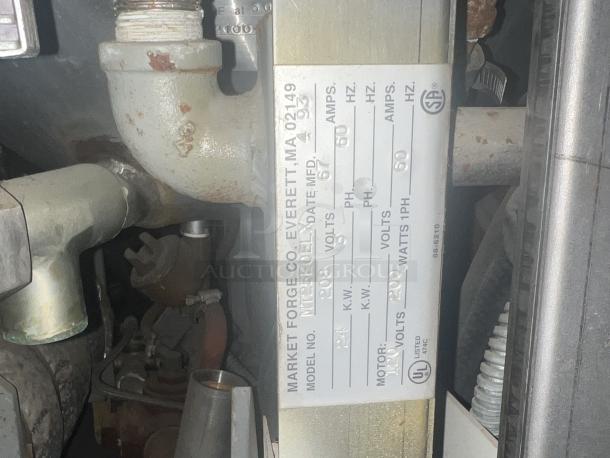 Market Forge Commercial Steamer Model MT25EOEL, single phase, dimensions 36x33x65.5 inches, visible label with specs.