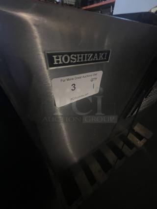 Hoshizaki 2000 lb. stainless steel flake ice maker, shown without storage, labeled for auction, good condition.