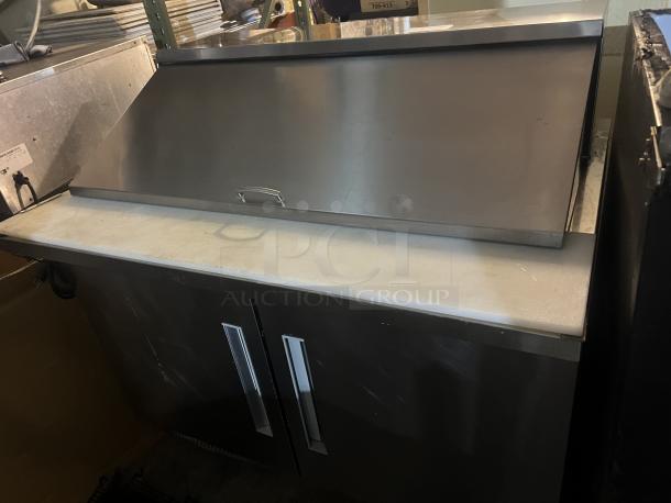 Stainless steel Berg prep table, model EDMT-48 18, 48"x34.5"x47", 120v, 293 lbs, dual doors, excellent condition.