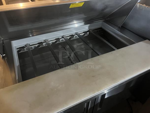 Berg EDMT-48 18 stainless steel prep table, 48x34.5x47, features spacious storage. 120v, 293 lbs, excellent condition.