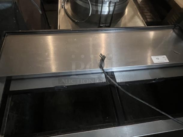 True Underbar Reach-in Bottle Cooler, Model TD-50-18, dimensions 49-¾ x 27 x 33-½, visible power cable, in good condition.