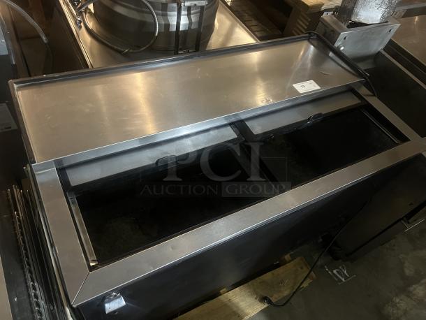 True Underbar Reach-in Bottle Cooler, Model TD-50-18. Stainless steel finish, dual sliding lids, dimensions 49-¾ x 27 x 33-½ inches.