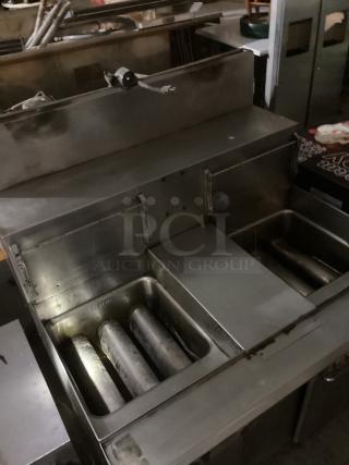 Keating Instant Recovery Double Fryer, Model TSFM14A, 115v, 40x36x47 inches. Stainless steel, dual basins, used condition.