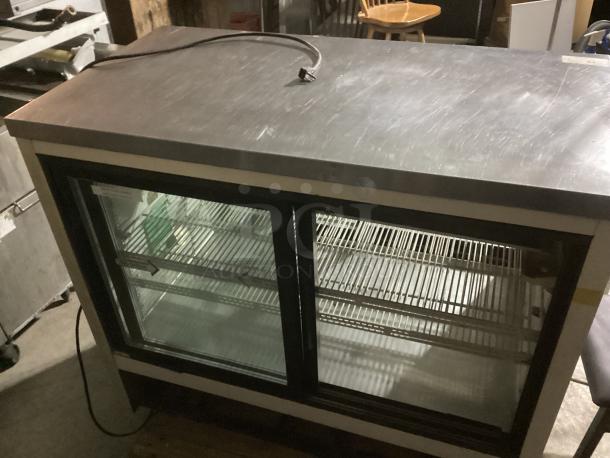 Wow! Refrigerated Deli Display Case, Model TSID-48-4-L, 48.5x29.25x42 inches, 120v, features glass front, shelves, well-maintained.