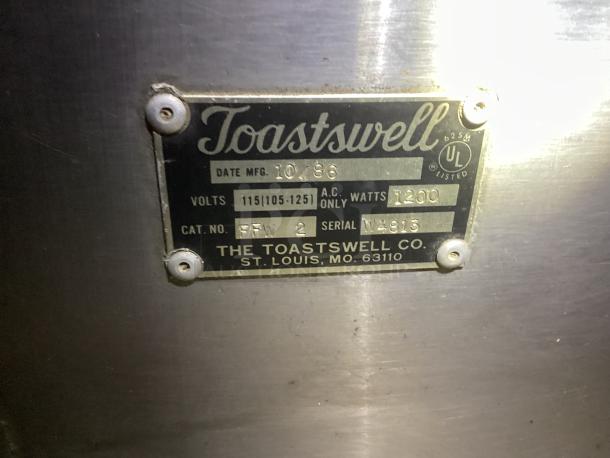 Toastwell Warming Drawers, Model FFW-2, 115 volts, 1200 watts, manufacture date 10/86, stainless steel tag detail.
