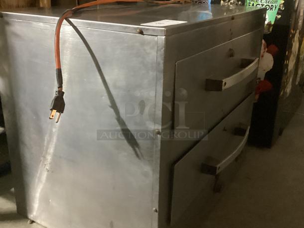 Toastwell Warming Drawers Model FFW-2, stainless steel, dual drawers, 28x19x23 inches, fair condition, visible power cord.