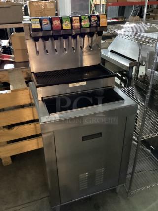 Stainless steel soda machine with ice bin, 25x25x54 inches, six drink dispensers, excellent condition, visible brand labels.