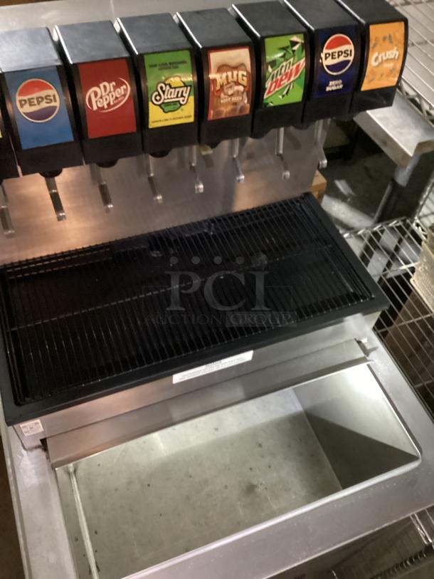 Stainless steel soda machine with six dispensers and ice holding bin, 25x25x54 inches, features Pepsi, Dr Pepper, Starry, Mug, Mountain Dew, Crush options.
