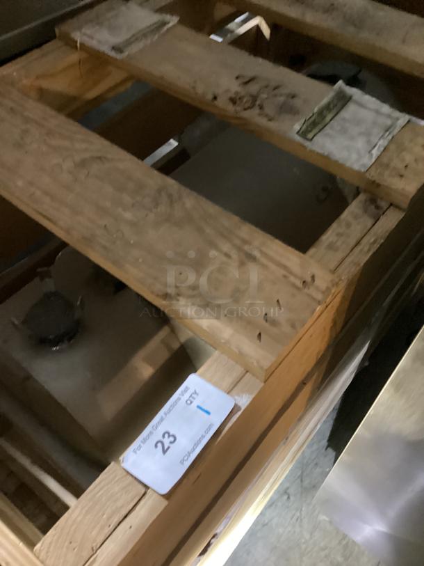 Tank in wooden crate, dimensions 48x25x33 inches. Visible tag indicates auction lot number 23, condition appears good.