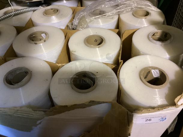 Pallet of 20 rolls of shrink wrap in cardboard cases. Rolls are white with cardboard cores. Item in unopened condition.