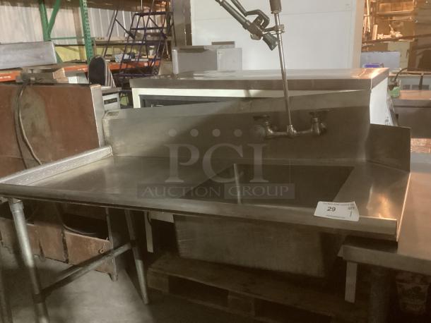Stainless steel wash sink runner, 60x31x45 inches, with dual faucet. Visible auction tag reads "29, Qty 1". In used condition.