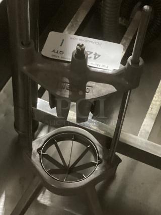Nemco Wedge Slicer, durable metal construction, equipped with sharp wedge-cutting blades, in used condition.