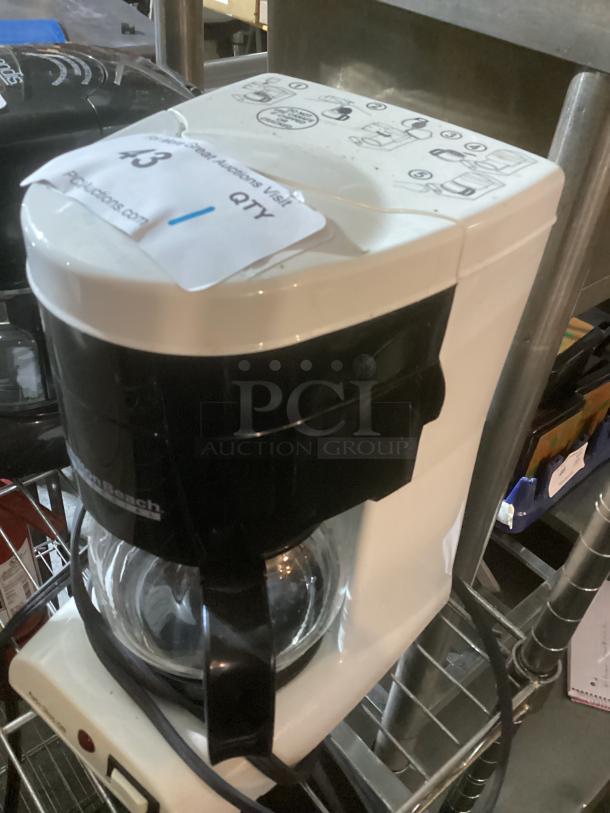 Hamilton Beach Commercial 4-Cup Coffee Pot, white and black, glass carafe, top instructions visible, minor wear.