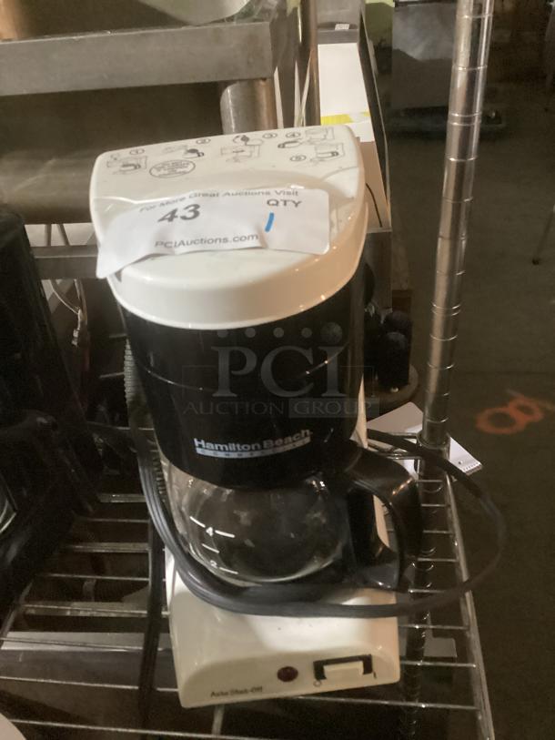Hamilton Beach Commercial 4-Cup Coffee Pot, black and white, glass carafe with measurement markings, labeled "43" for auction.