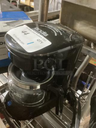 Andi's Commercial 4-Cup Coffee Pot, black, glass carafe, visible power button, commercial use. Good condition. Brand tag on top.