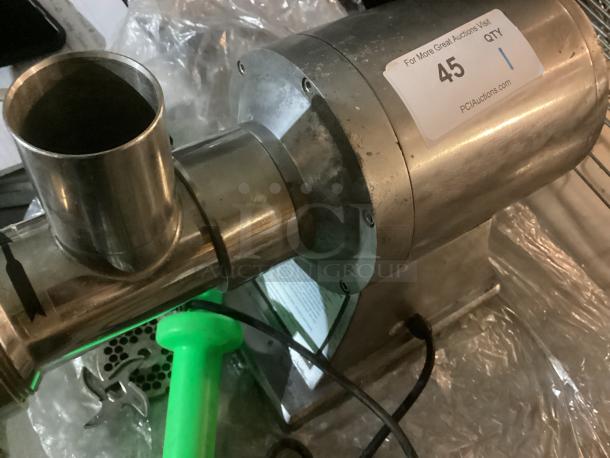 Al-Type meat grinder with accessories, stainless steel, 8x8x14 inches, includes blade and pusher, label shows auction info.