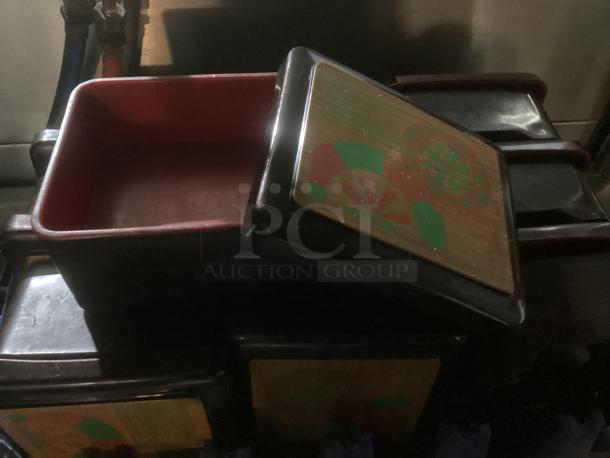 Plastic trinket boxes, set of 10, black with decorative lids, one open showing red interior, in good condition.