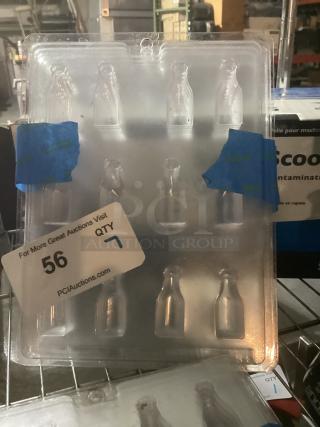 Clear plastic wine bottle candy mold, 7 cavities, used condition. Auction tag indicates quantity of 7 molds available.