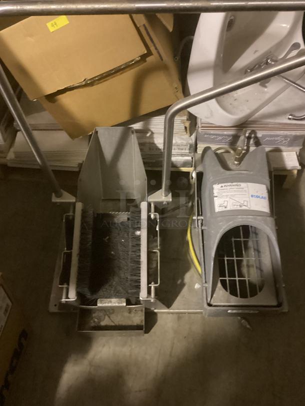 Eco Lab Foot Scrubbers, dual-unit setup with brush and pedal control, grey metal and plastic, used condition, visible label.