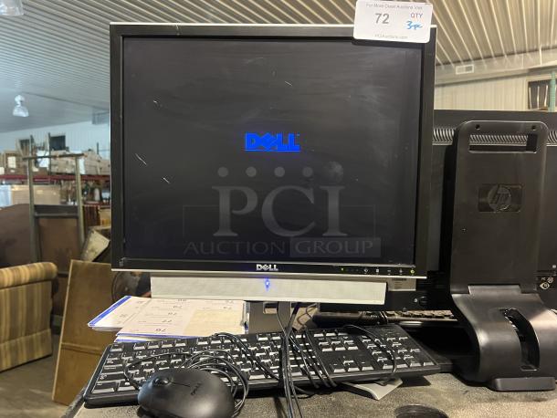 Dell 17-½" monitor, model #2007FPB, with keyboard and mouse. Monitor shows signs of use. Auction label visible.