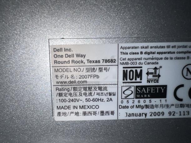 Dell 2007FPB 17.5" monitor, made in Mexico, with keyboard and mouse, label indicating compliance and safety marks, dated Jan 2009.