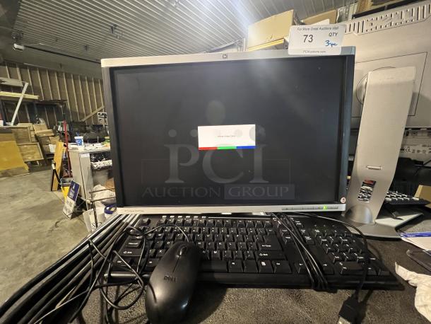 HP 20" LA2205WG monitor with Dell keyboard and mouse in used condition; label indicates auction lot 73.