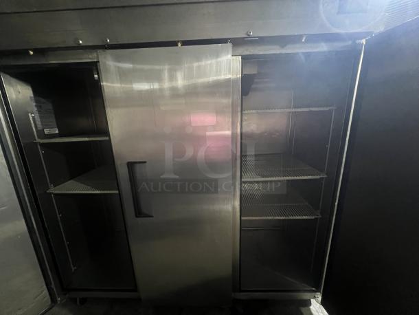 ELine ER72-3-N-V stainless steel 3-door cooler, 78"x30"x79.5", tested and working, features wire shelves.