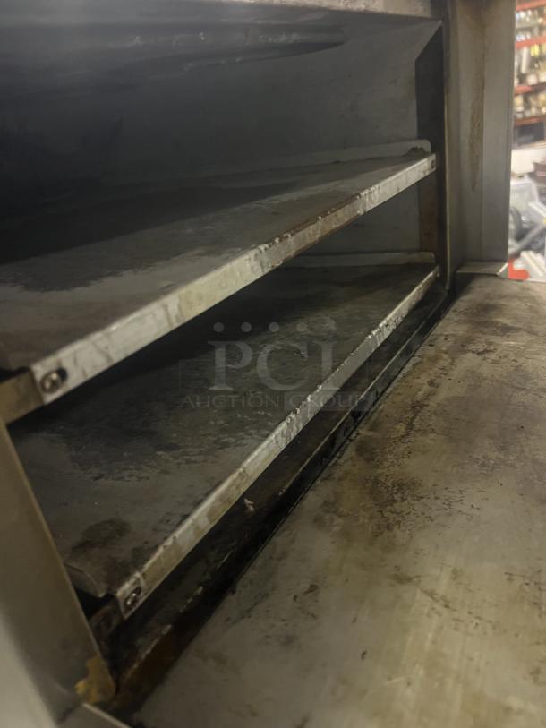 APW Wyott Countertop Electric Pizza Deck Oven, Model CD0-17, features double deck design, visible wear, size 22x22.5x17.5 inches.