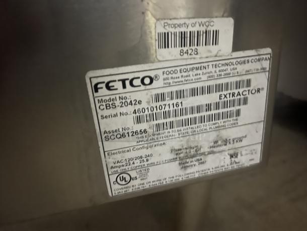 Fetco Double Coffee/Tea Brewer, Model CBS-2042e, with labels showing serial and asset numbers. Size: 19x16x34.5 inches.